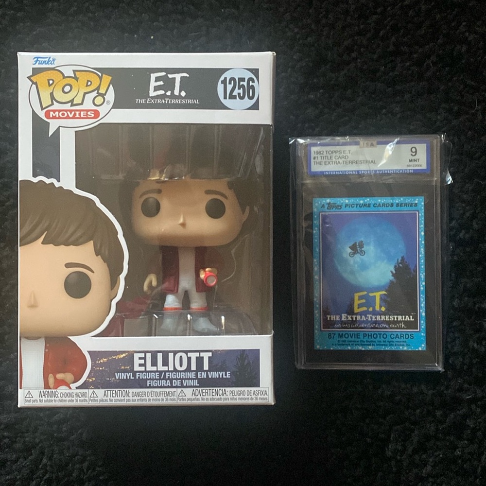 Set of 2 E.T collection. 1 funko pop. 1 graded movie title card